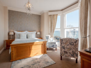 Elm Tree Hotel sea-view bedroom with large period windows and traditional styling