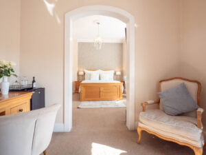 Bright white room at the Elm Tree Hotel with ornate archway