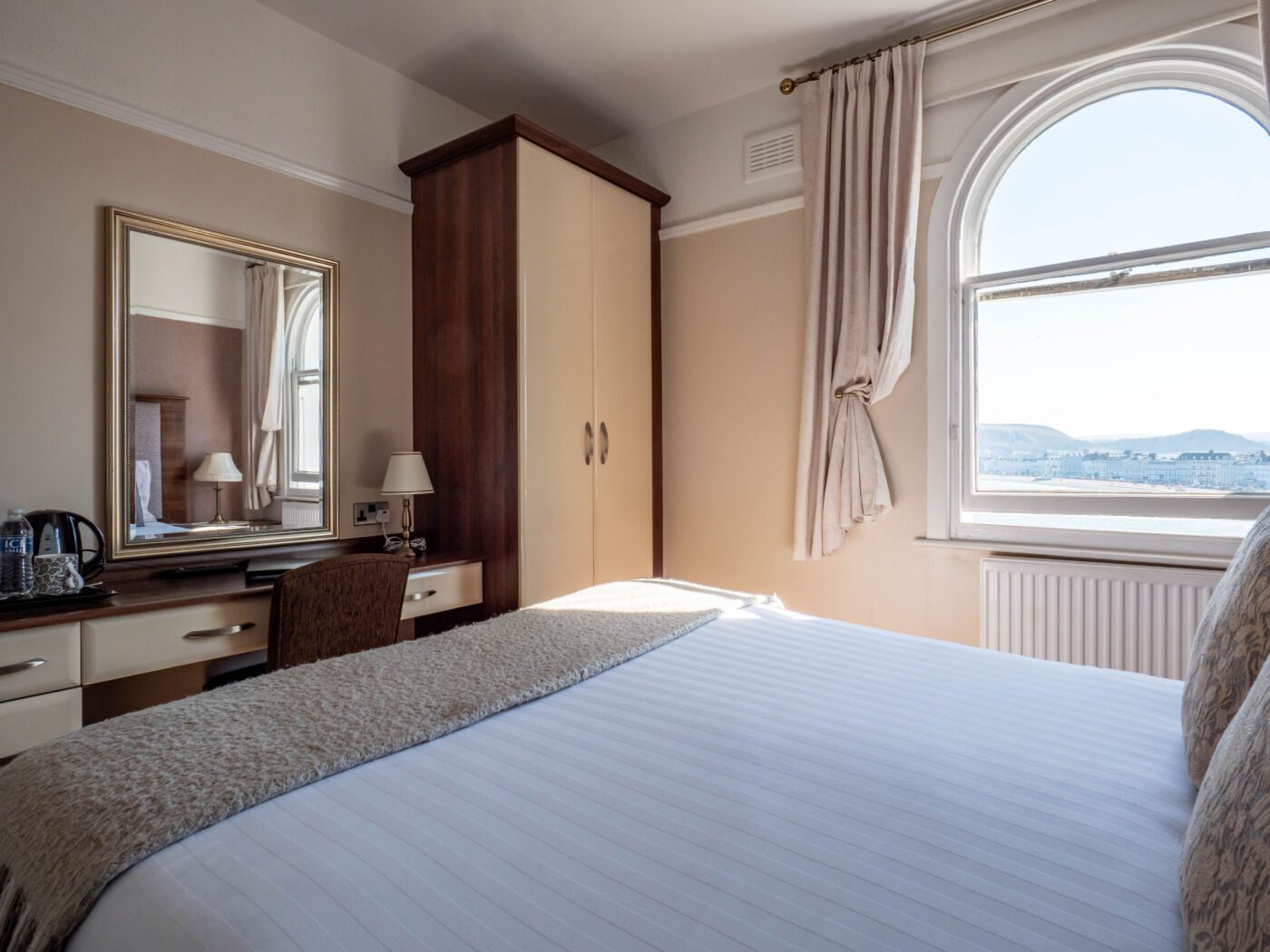 Elm Tree Hotel double bedroom with patterned headboard and traditional styling